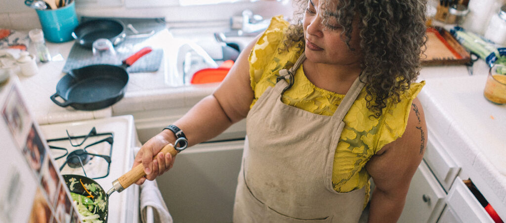 Lady preparing her GLP-1 meal plan at home to promote weight loss and muscle building while taking a medication like Ozempic, Wegovy, Mounjaro, or Zepbound