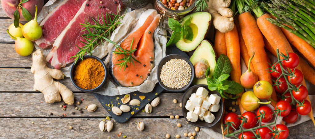 Spread of healthy food with protein, vegetables, fiber, healthy fats, fruits, and more illustrating a balanced diet for individuals taking GLP-1 medications for weight loss and diabetes management