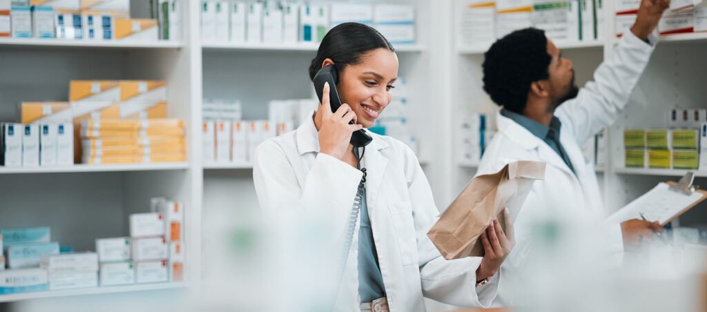 Pharmacist examining various GLP-1 medications for weight loss including Ozempic, Trulicity, Victoza, Mounjaro, and Wegovy