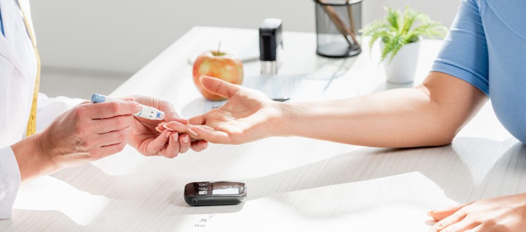 Medical professional pricking the finger of a man with diabetes to test blood sugar levels while taking GLP-1 medications like Ozempic, Mounjaro, Wegovy, and Trulicity