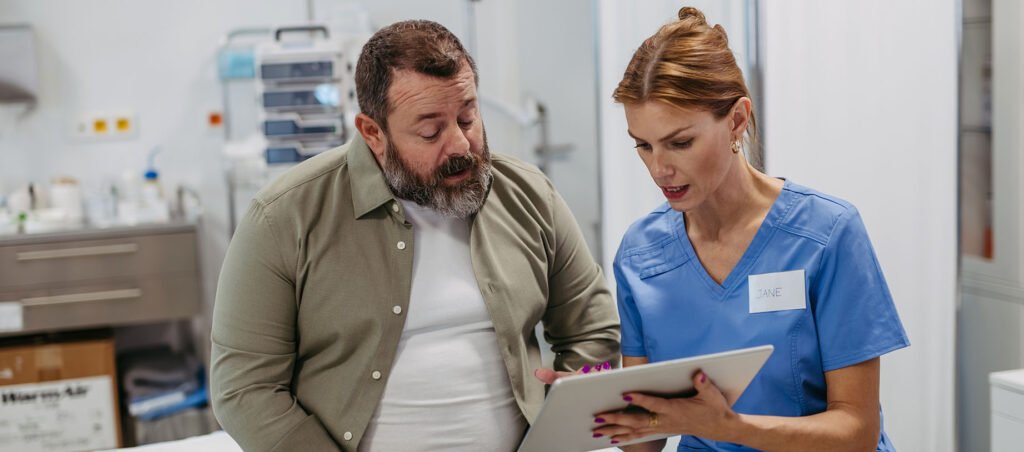 Female medical professional explaining mechanism of action of Semaglutide (Ozempic) to an older patient looking to lose weight with GLP-1 medications