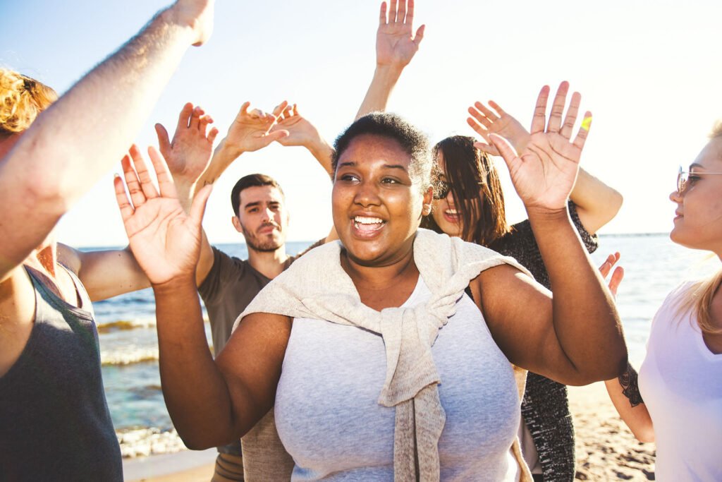 People in weight loss community giving high fives to support mindset & mental health for GLP-1 patients