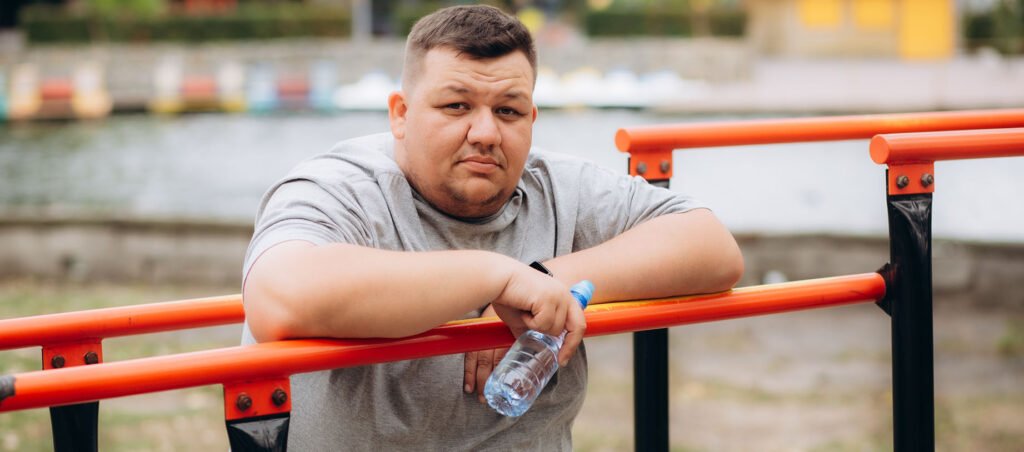 Man exercising & keeping positive mindset to support weight loss while taking drugs like Ozempic, Wegovy, & Mounjaro