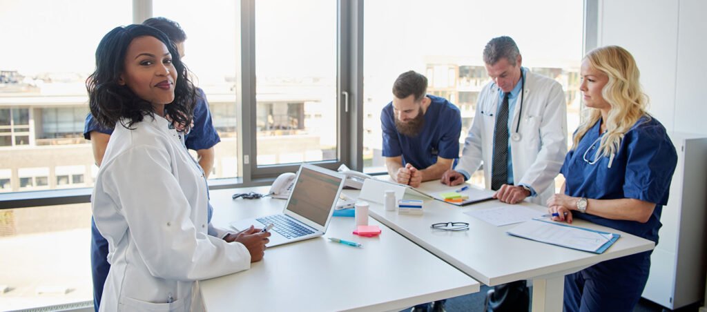 Group of doctors, nurses, and medical professionals at a weight loss obesity clinic consulting with patients taking GLP-1 prescriptions like Ozempic, Wegovy, Zepbound, and Mounjaro