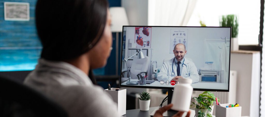 GLP-1 patient on weight loss prescription drug consulting with an obesity medicine doctor remotely via telehealth and telemedicine