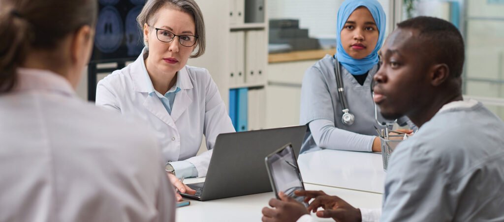 Group of medical professionals in hospital setting reviewing clinical trials for GLP-1 medications like Trulicity (Dulaglutide) for weight loss and diabetes