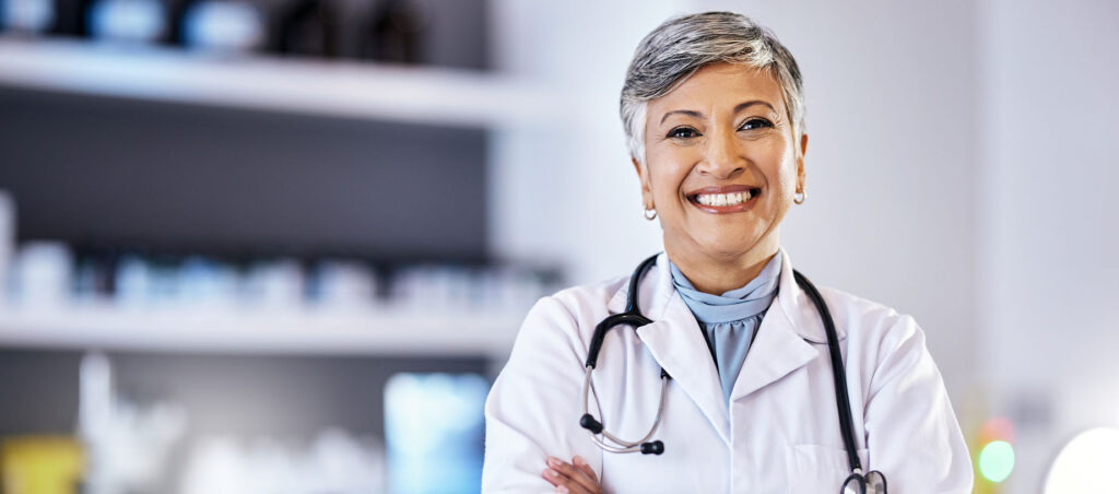 Female obesity medicine doctor smiles to the camera in a hospital setting