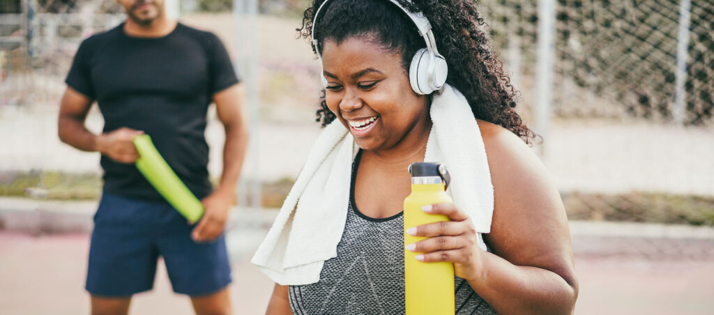 Lady exercises outside with personal trainer as she makes lifestyle changes along her weight loss journey with GLP-1 medications like Semaglutide