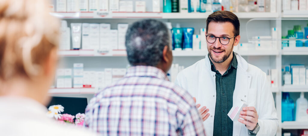 Male pharmacist works with patient to fill GLP-1 prescription for compounded Semaglutide as part of holistic medical weight loss and diabetes management plan