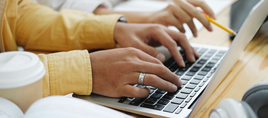 Lady types an appeal letter on her computer to an insurance company for her GLP-1 weight loss medication