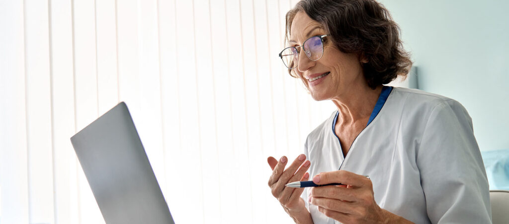 Female nurse practitioner meets with GLP-1 patient via telehealth or telemedicine as part of consult for medical weight loss