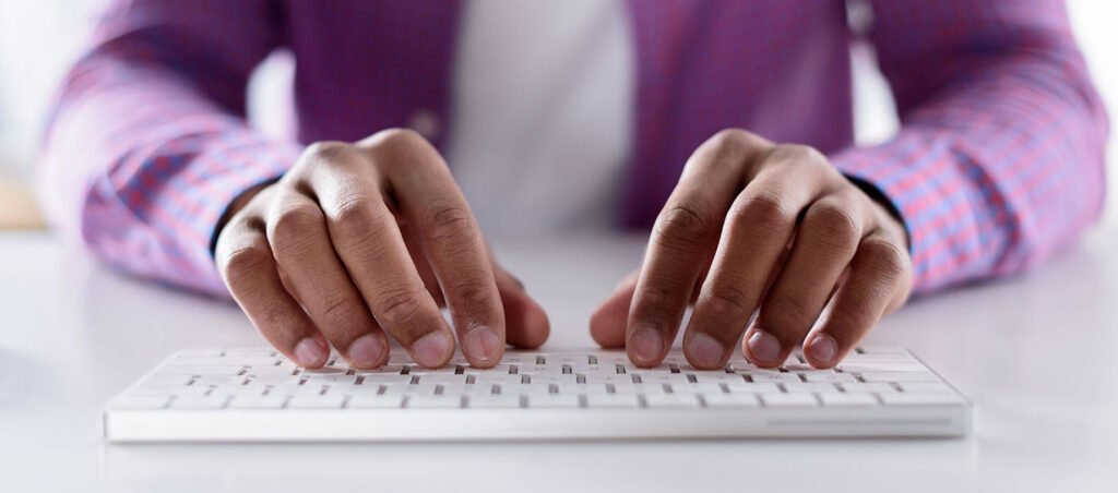 Patient writes an online review on a computer for the medical weight loss clinic that prescribed her GLP-1 Ozempic medication