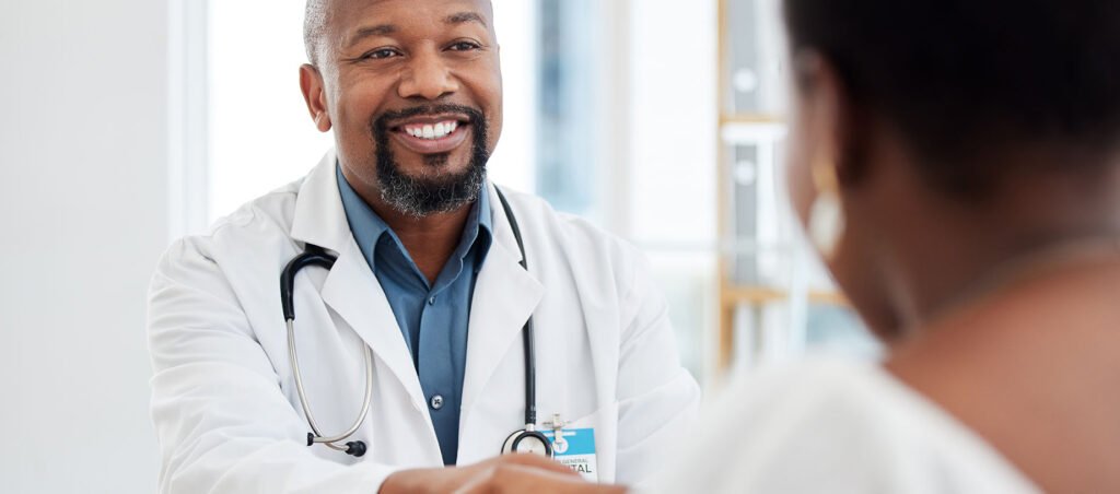 Doctor shakes hands with patient in his obesity medicine clinic reinforcing the importance of holistic, patient-centered care