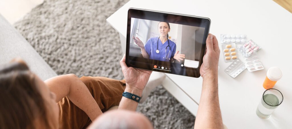 Older couple speaks with medical provider via telehealth on iPad to discuss obesity medicine, medical weight loss, and diabetes management