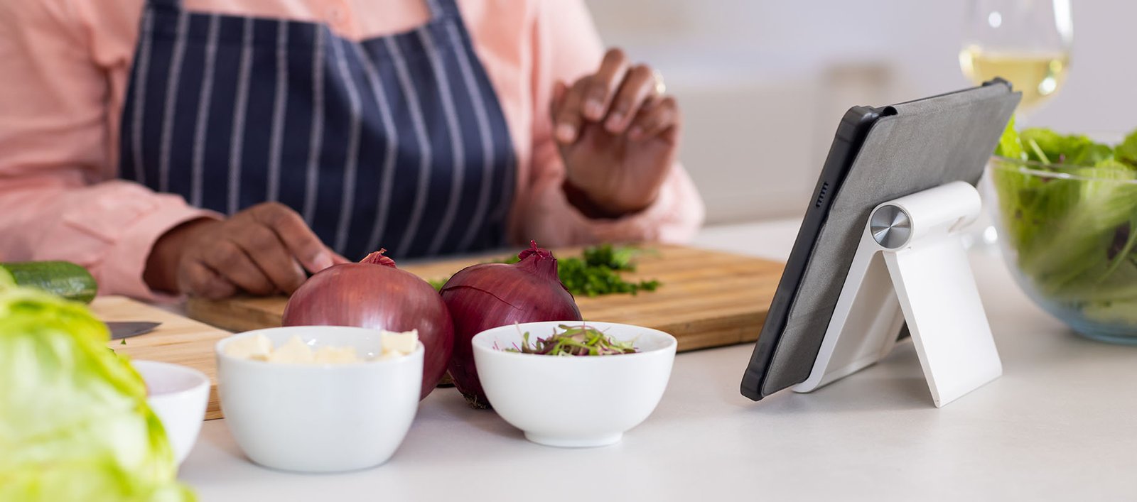 Country club or wellness club member using the Alterra Health lifestyle care platform at home to prepare a healthy, nutritious meal to support wellness, weight loss, and longevity.
