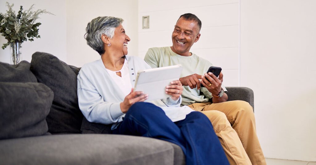 Happy couple smiling using Alterra Health lifestyle platform for country clubs and wellness clubs.