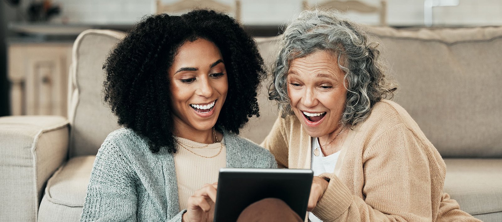 Older lady and her daughter, both members of a country club, using the Alterra Health lifestyle platform to learn nutrition fundamentals.